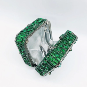Detail of green crystal evening clutch bag with silver metallic lining and chain strap