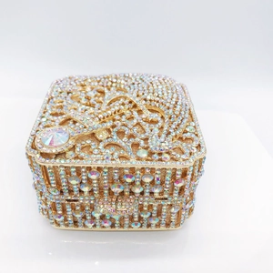 Macro detail of golden hollow metal frame with sparkling colorful rhinestones