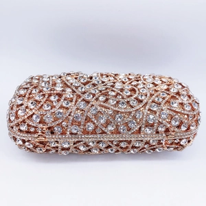 Pochette de soirée ajourée avec strass scintillants et monture en métal or rose