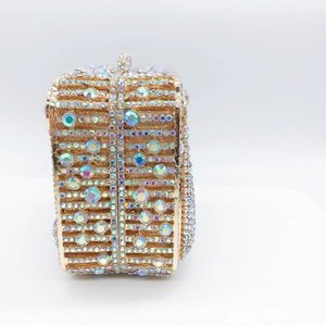 Macro detail of luxury evening clutch with AB crystals and gold metal frame structure