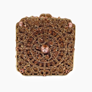 Detail of square clutch bag with champagne crystals and large pink center stone