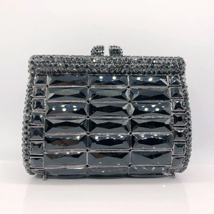 Macro shot of luxury black faceted crystal rows on hard shell rhinestone clutch bag