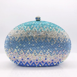 Close-up of gradient rhinestone clutch bag with sparkling crystal surface and top clasp