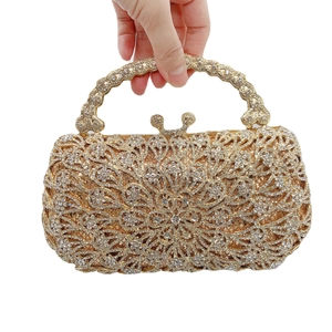 Luxury gold evening clutch with phoenix tail flower pattern and sparkling white rhinestones