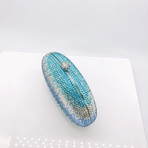 Detailed close-up of blue gradient rhinestone evening clutch with diamond clasp