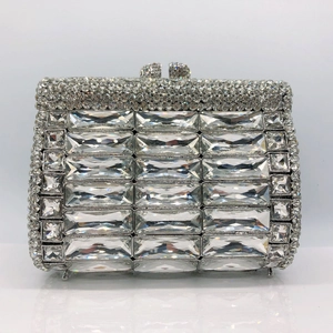 Macro shot of silver frame and rectangle crystals on luxury rhinestone clutch purse