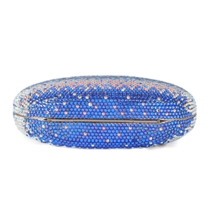 Detail view of blue and silver wave pattern rhinestones on this oval evening clutch
