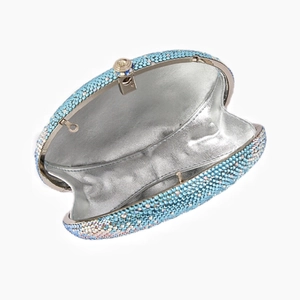 Macro detail of luxury evening clutch purse featuring gradient blue rhinestones and silver lining