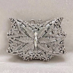 Elegant silver butterfly clutch bag encrusted with sparkling rhinestones for formal evening events