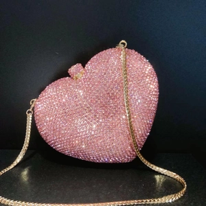 Sparkling pink heart-shaped crystal evening clutch bag with elegant gold chain strap