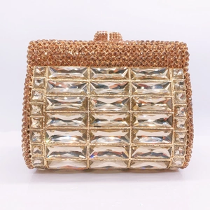 Front view of champagne gold evening clutch with luxury rectangular crystals and clasp