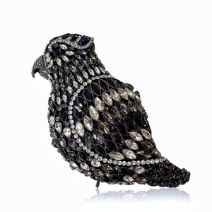 Elegant bird shaped evening clutch bag with black and clear sparkling crystals