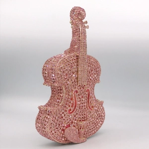 Detailed view of sparkling pink rhinestones on a violin-shaped evening clutch bag