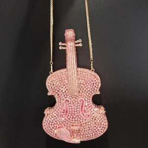 Violin shaped evening clutch bag with pink rhinestones and golden chain strap