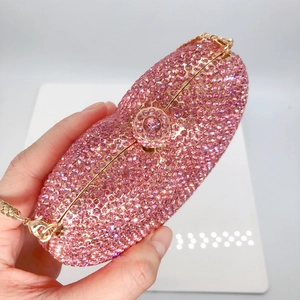 Pink heart-shaped rhinestone evening clutch bag with golden chain and crystal rhinestones