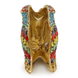 Detailed interior of luxury parrot shaped clutch bag with colorful crystals and gold chain