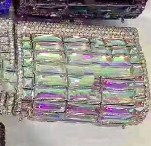Close-up of rectangular evening clutch with rainbow crystals and white rhinestone accents