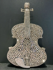 Detailed view of luxury violin shaped clutch bag with sparkling rhinestones decoration