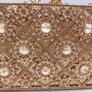Luxurious champagne gold clutch featuring diamond sunflower pattern and crystal mesh
