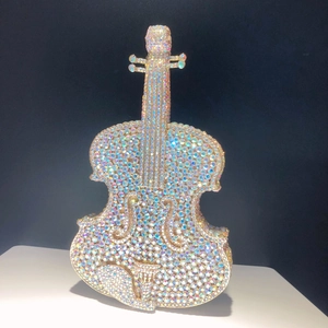 Detailed view of luxury violin-shaped clutch bag with iridescent AB crystal rhinestones