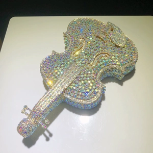 Detailed top view of a violin-shaped evening clutch bag with sparkling AB crystal rhinestones