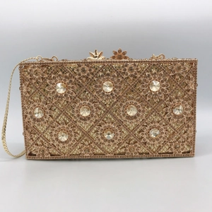 Elegant champagne gold sunflower evening clutch bag with diamonds and floral cutouts
