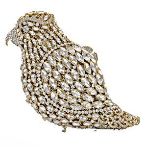 Macro detail of bird-shaped clutch bag encrusted with sparkling crystals and gold frame