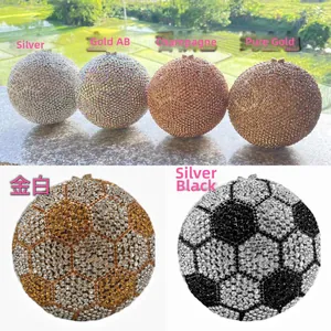 Close-up of luxury spherical evening clutch with sparkling rhinestones and metal latch