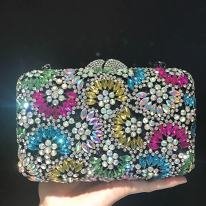 Sparkling crystal rhinestone clutch bag with vibrant rainbow fan pattern and metal clasp