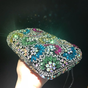 Chic evening clutch bag with colorful rhinestones and elegant chain for formal dinner