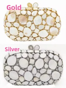 Detailed look at shell texture and rhinestones on gold and silver evening clutches