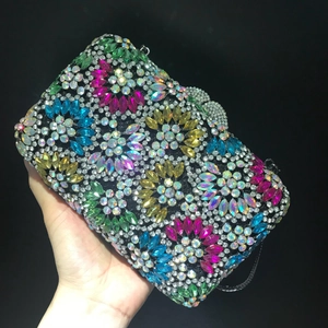 Sparkling crystal evening clutch bag with colorful floral rhinestone patterns and hand strap