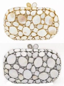 Exquisite shell-patterned clutch bags in gold and silver with sparkling rhinestones