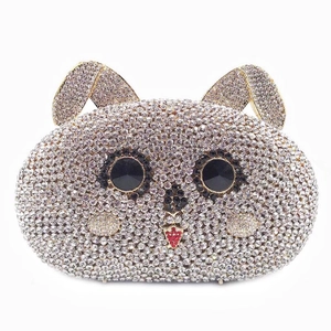 Detail of crystal-encrusted rabbit evening bag with sparkling silver and red rhinestones