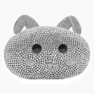 Close-up of sparkling rabbit evening bag with silver rhinestones and black gem eyes