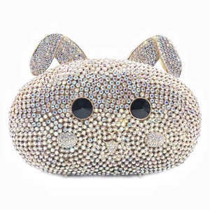 Macro detail of hand-set sparkling crystals on rabbit shaped luxury evening clutch bag