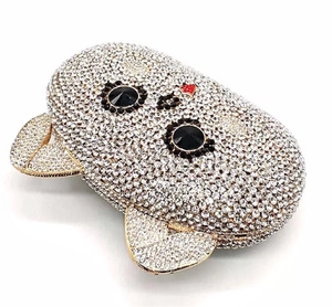 Close-up of luxury animal evening clutch featuring silver rhinestones and gold metal edges