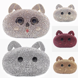 Detail of crystal rabbit clutch bags in pink, white and red with luxury rhinestones