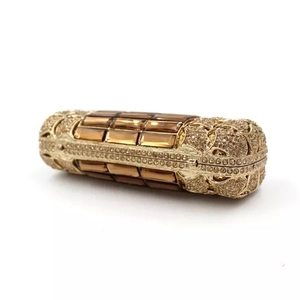 Luxury gold evening clutch bag with amber crystals and rhinestones in a cylinder shape