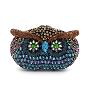 Close-up of vibrant multicolored rhinestones and intricate owl-shaped jewelry details