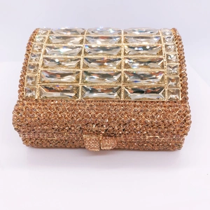 Luxurious champagne rhinestone clutch purse with crystal accents and gold metal frame