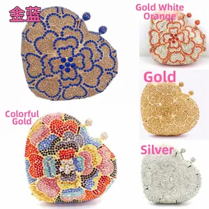 Detail view of heart-shaped evening clutches featuring floral patterns and rhinestones
