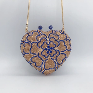 Champagne heart-shaped rhinestone clutch with blue floral patterns and gold chain