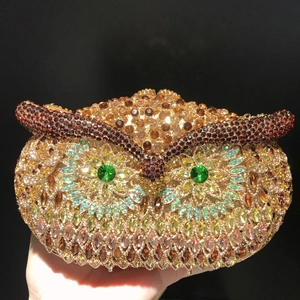 Exquisite owl evening clutch bag with champagne crystals and emerald green rhinestone eyes