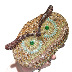Luxury owl shaped evening clutch bag encrusted with gold and brown rhinestones