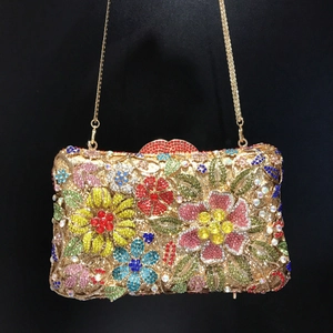 Exquisite floral diamond clutch with colorful rhinestones and gold chain strap