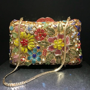 Luxury floral crystal clutch bag with colorful rhinestones and gold snake chain strap