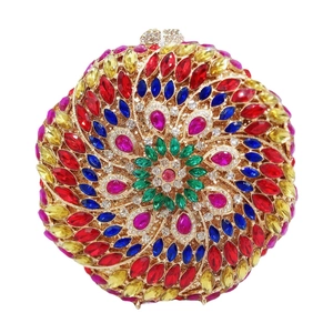 Elegant round evening clutch bag with colorful rhinestones in floral sunburst pattern