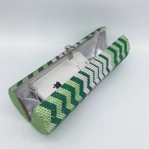 Green and white crystal studded evening clutch bag with chain strap and luxury waves