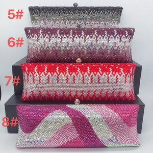 Detailed view of handmade crystal evening clutch bags in various gradient colors